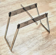 A stainless steel camping wood burning stove that burns multiple fuels. This micro wood stove can fit into a wallet, or altoids tin stove.