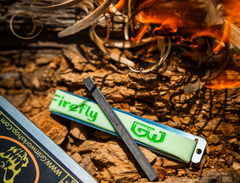 Firefly Heat fire starter tool shown on a keychain highlighting slim profile and compact size.