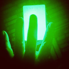 Glow card showing even light distribution and flat profile for wallet carry.