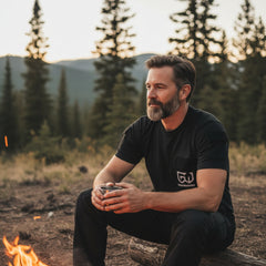 Tactical t shirt worn with everyday carry gear stored in external pockets.