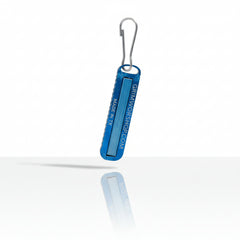 Hot Shot micro tool fire starter keychain shown next to keys to demonstrate compact everyday carry size.