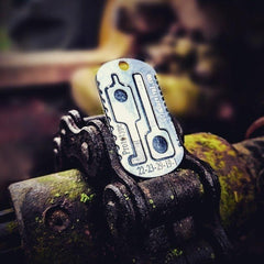 Emergency esacpe and evasion tools on a tactical necklace escape kit. 